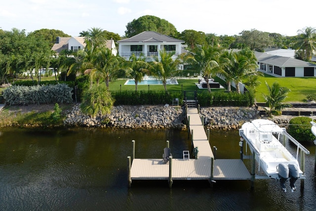 view of dock featuring a yard and a water view