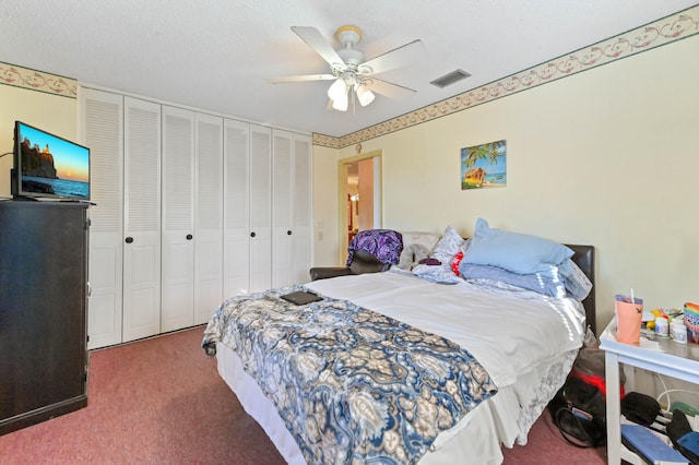 carpeted bedroom featuring a closet, ceiling fan, and a textured ceiling