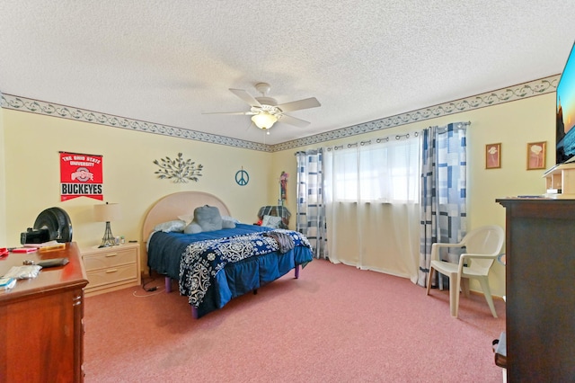 bedroom with carpet flooring, a textured ceiling, and ceiling fan