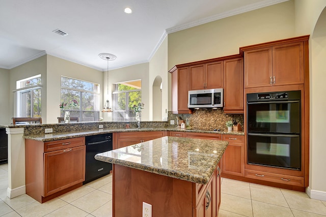 kitchen featuring black appliances, pendant lighting, light tile patterned flooring, and crown molding