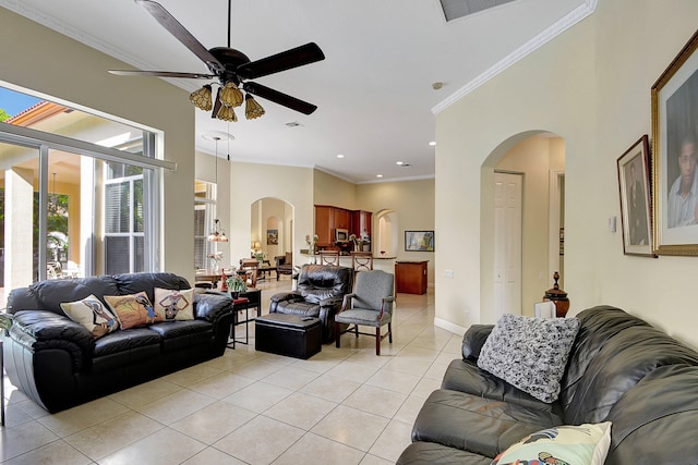 tiled living room featuring ceiling fan and ornamental molding