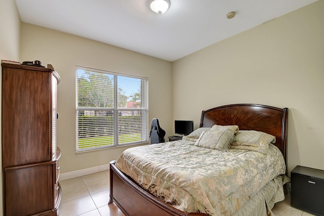 bedroom with light tile patterned flooring