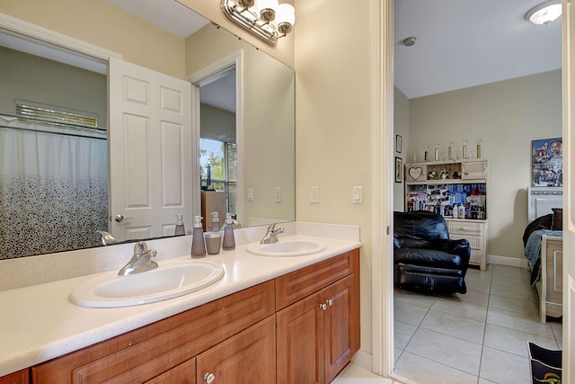 bathroom with tile patterned flooring and vanity