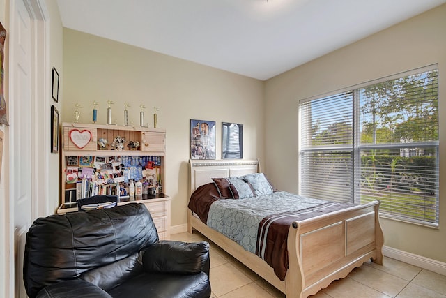 bedroom with light tile patterned flooring