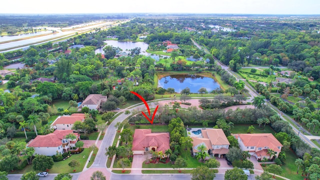 birds eye view of property with a water view