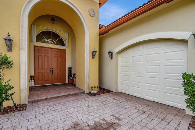 property entrance with a garage