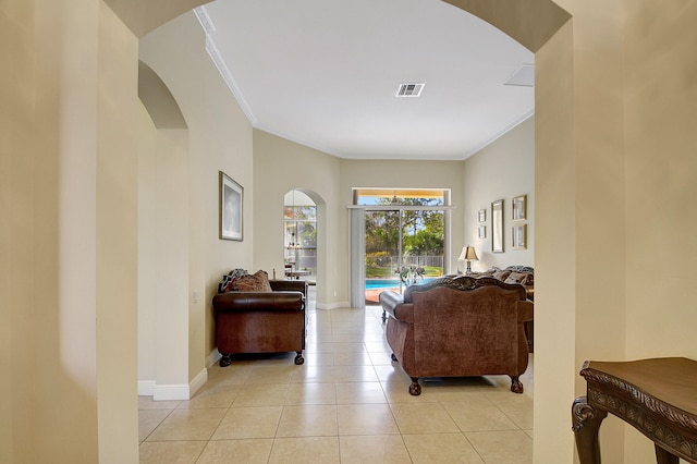 tiled living room featuring crown molding