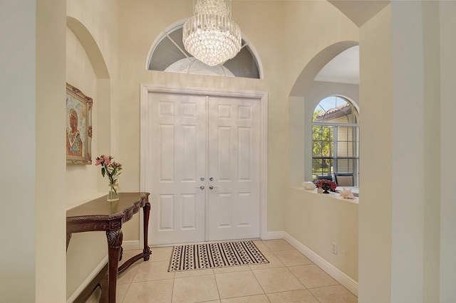 tiled foyer entrance with ornamental molding