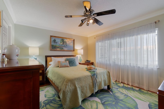 bedroom featuring ceiling fan and crown molding