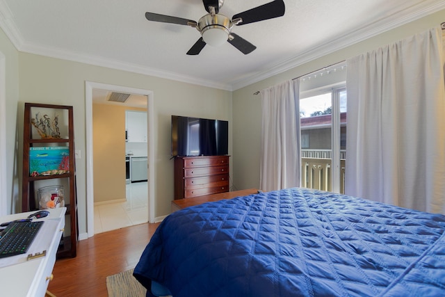 bedroom featuring ceiling fan, wood-type flooring, and ornamental molding