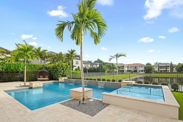 view of swimming pool with a water view, pool water feature, and a patio