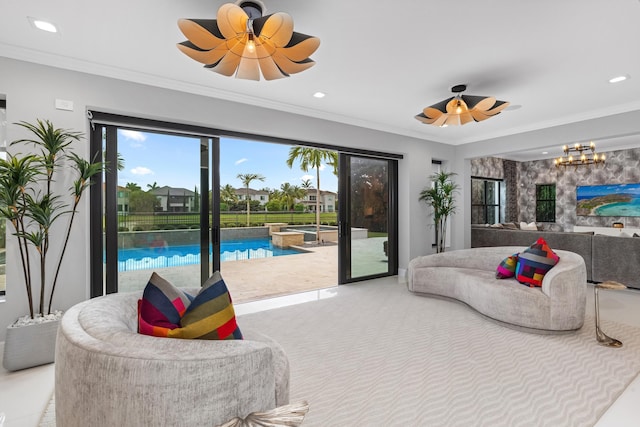 bedroom with ceiling fan, ornamental molding, and access to exterior