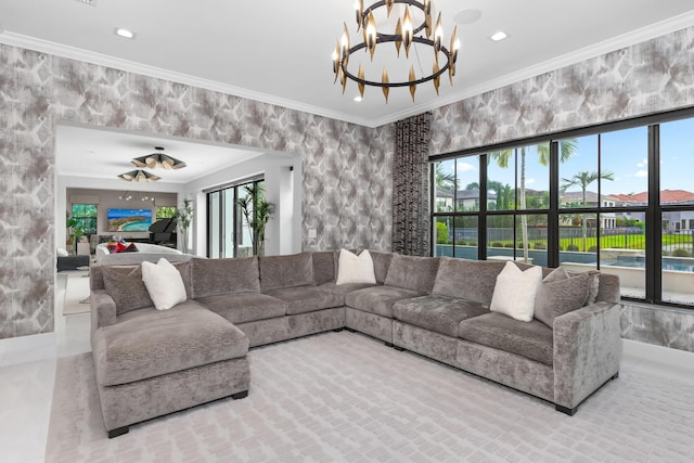 living room with a notable chandelier and crown molding