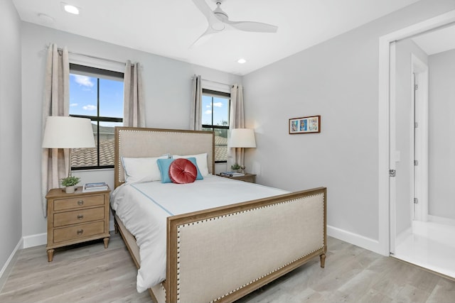 bedroom with multiple windows, ceiling fan, and light wood-type flooring