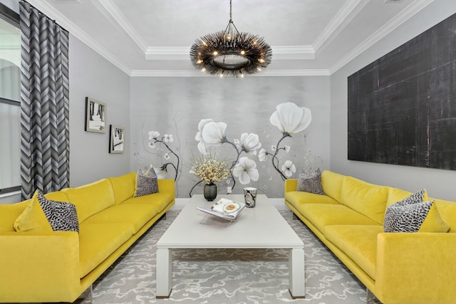 living room with ornamental molding, a tray ceiling, and a notable chandelier