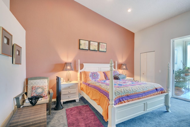 carpeted bedroom featuring access to exterior, a closet, and vaulted ceiling