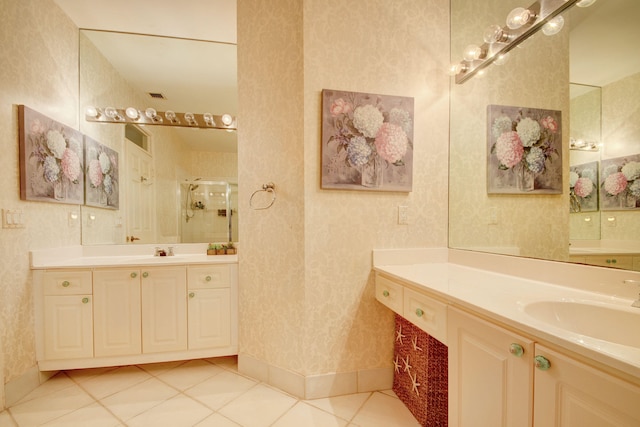 bathroom featuring tile patterned floors, vanity, and a shower with shower door