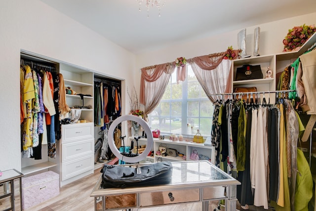 spacious closet featuring light wood-type flooring