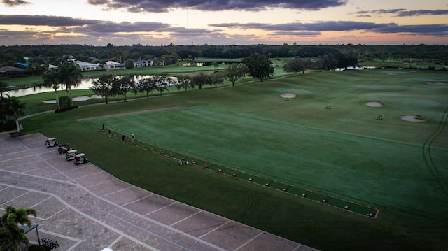 aerial view at dusk with a water view