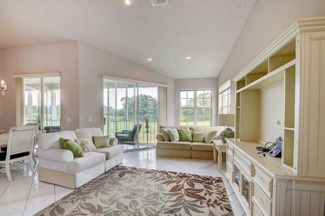 tiled living room with a textured ceiling and vaulted ceiling