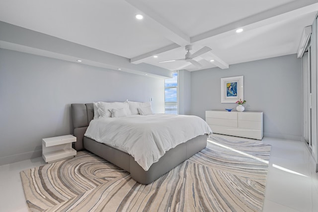 bedroom with ceiling fan and beamed ceiling