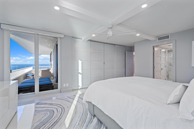 bedroom featuring ceiling fan, beam ceiling, a water view, and access to outside