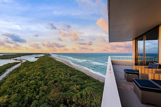 exterior space featuring a water view and a view of the beach