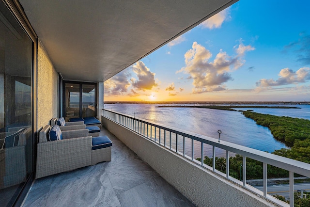 balcony at dusk with a water view