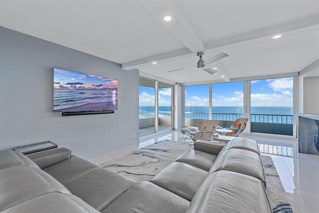 tiled living room with beamed ceiling, ceiling fan, and floor to ceiling windows