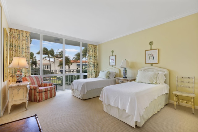 carpeted bedroom with access to exterior, expansive windows, and ornamental molding