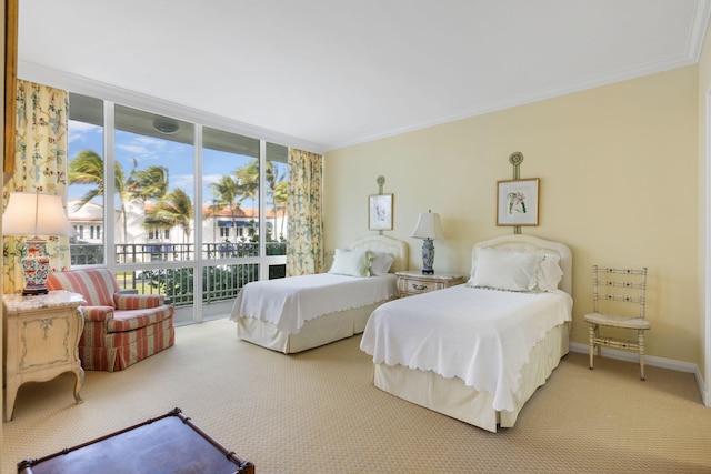 bedroom with carpet flooring, access to exterior, a wall of windows, and ornamental molding