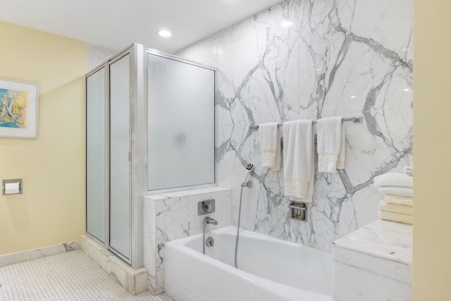 bathroom featuring tile patterned floors and independent shower and bath