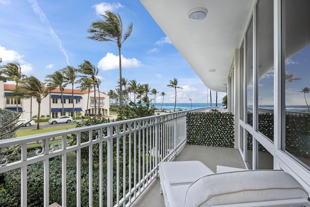 balcony featuring a water view