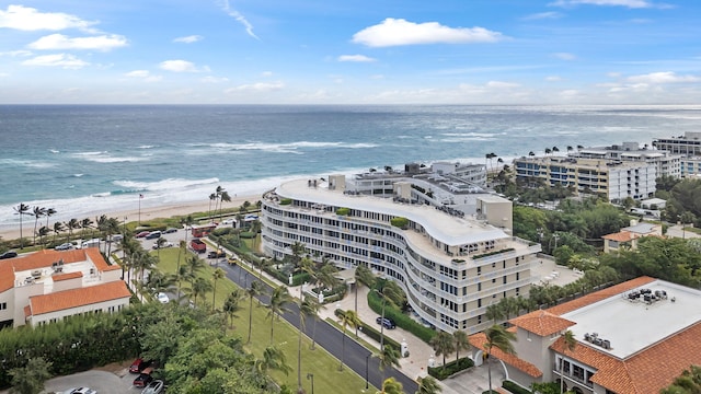 bird's eye view with a water view and a view of the beach