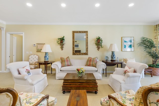 living room with ornate columns, crown molding, and light colored carpet