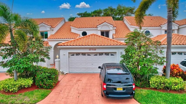 mediterranean / spanish-style house featuring a garage