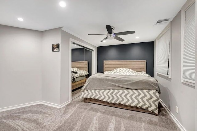 carpeted bedroom with ceiling fan