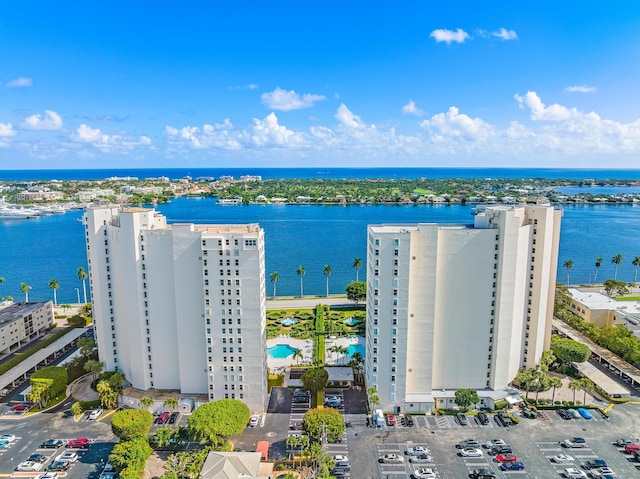 birds eye view of property with a water view