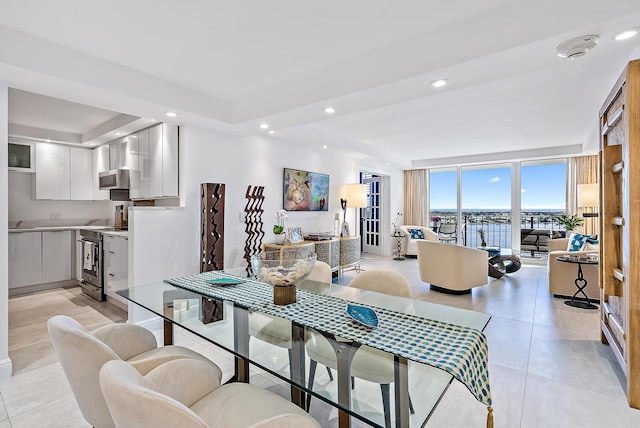 tiled dining room with expansive windows