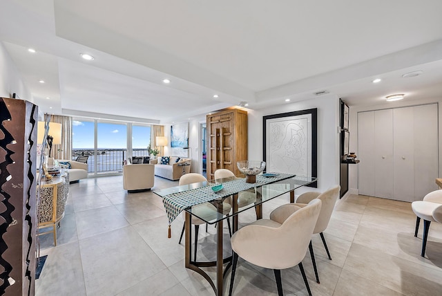 tiled dining room with expansive windows