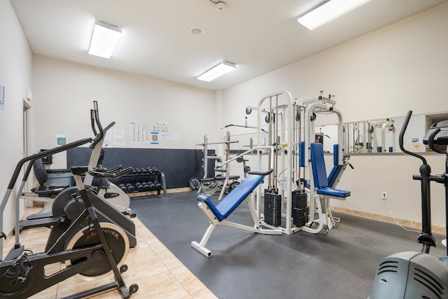 workout area with a textured ceiling