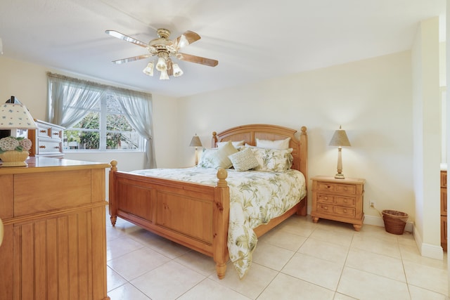 bedroom with ceiling fan and light tile patterned flooring