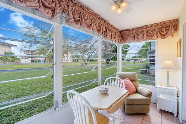 sunroom / solarium with ceiling fan