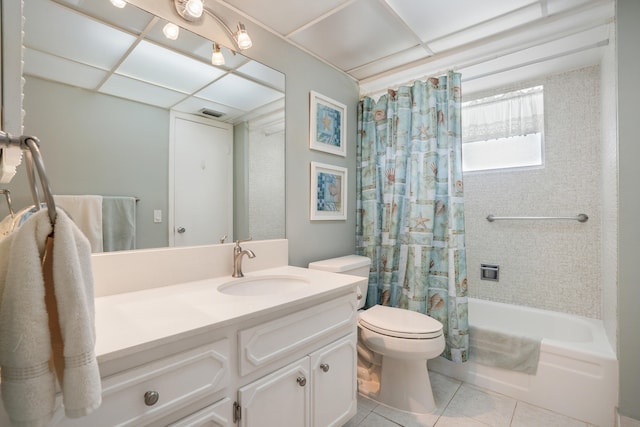 full bathroom with tile patterned floors, vanity, toilet, and shower / bath combo with shower curtain