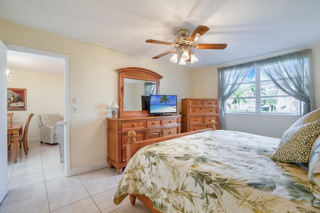 bedroom featuring ceiling fan and light tile patterned flooring