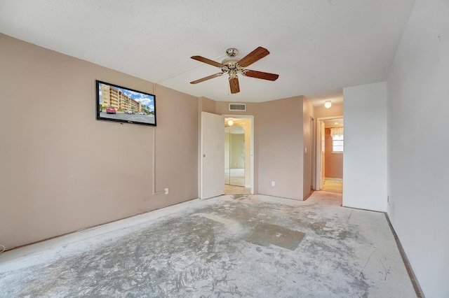 spare room with ceiling fan