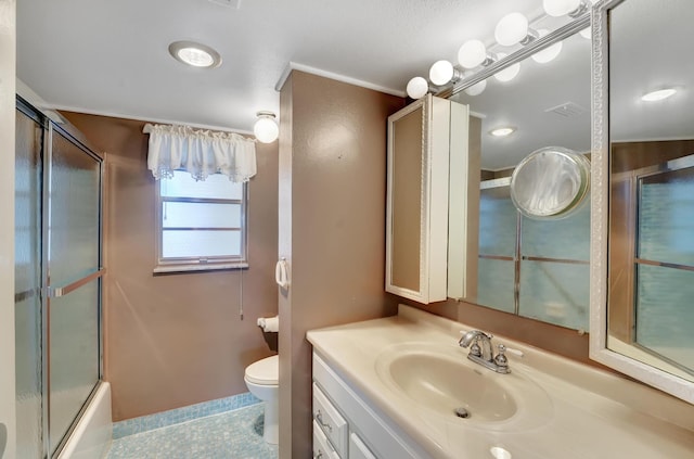 full bathroom with tile patterned flooring, vanity, toilet, and combined bath / shower with glass door