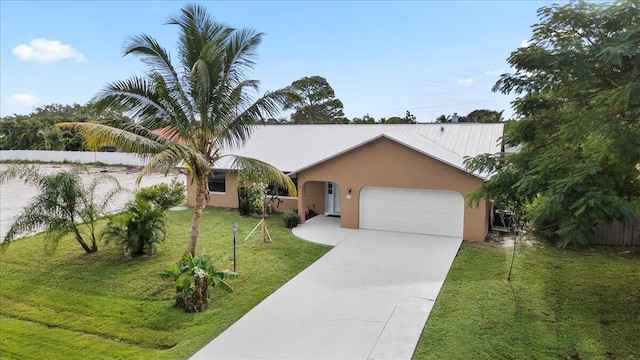 ranch-style home featuring a garage and a front lawn