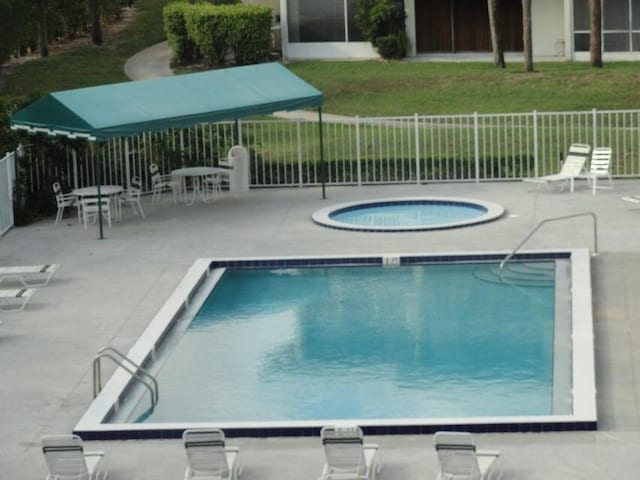 view of swimming pool featuring a patio