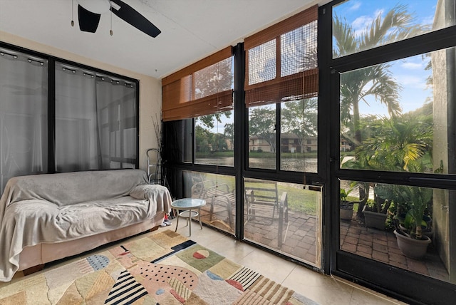 sunroom with plenty of natural light and ceiling fan